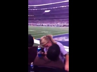 a couple on football is engaged in hard petting